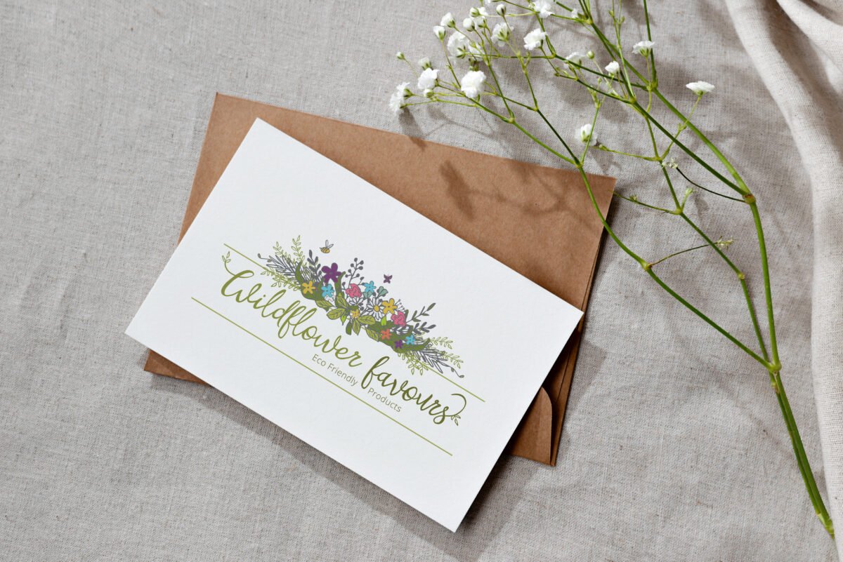 Wildflower Favours logo by Bridget Designs on a card and envelope with flowers in background